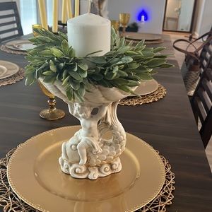 Cherub sitting on fish